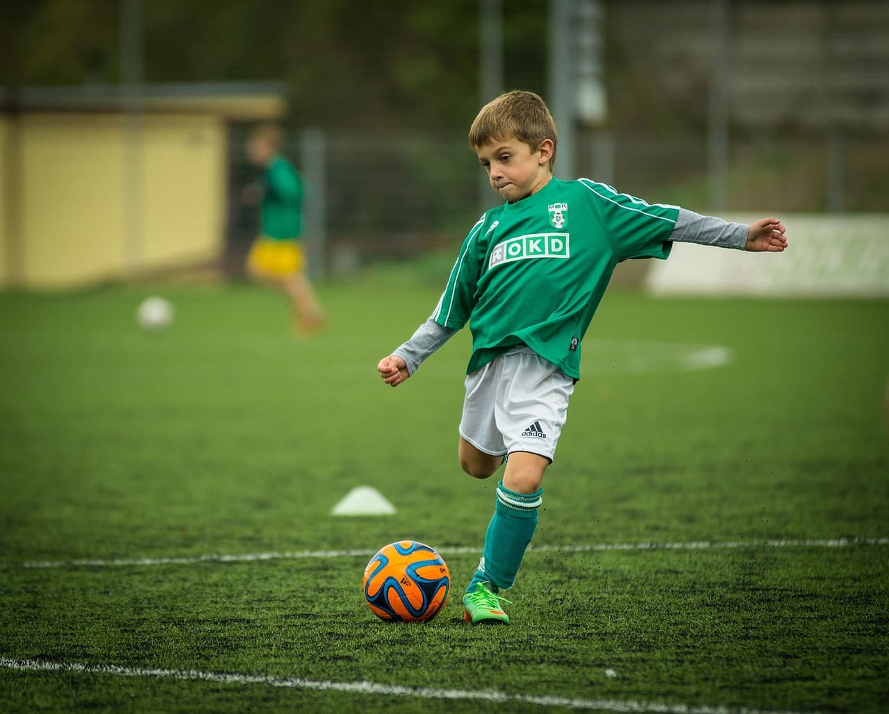 Soccer coach leading a training session on the field